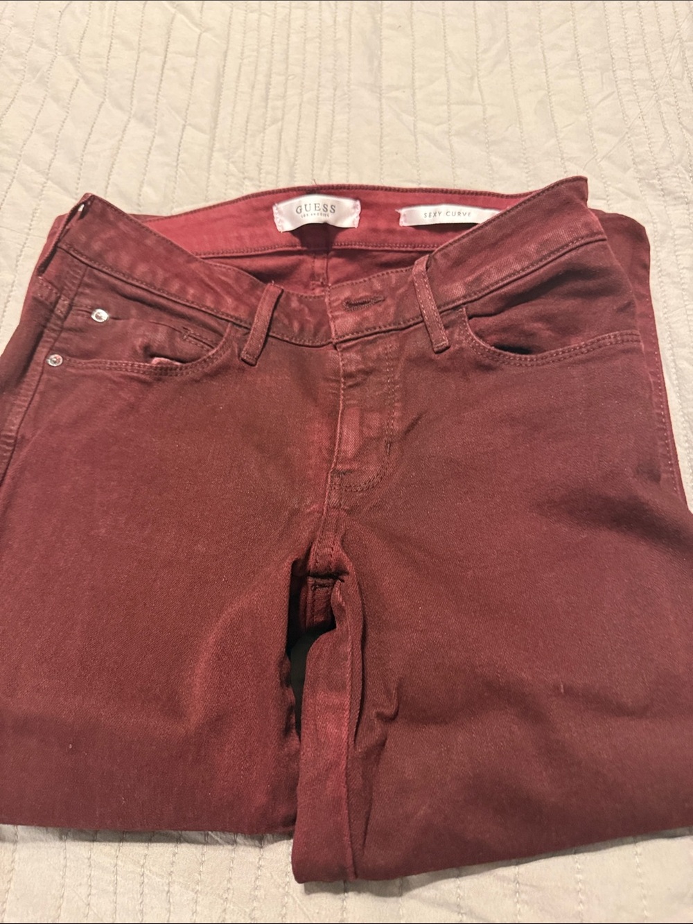 GUESS women’s Wine Slim Jeans